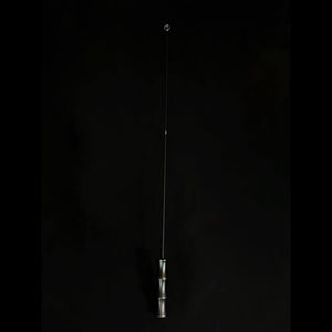 A minimalist bamboo teaser rod standing against a plain black background, highlighting the sleek and modern design of the product.
