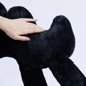 Close-up of a hand touching the soft, plush surface of the Boom Boom Cat Cushion Black.