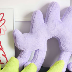 Close-up of the Gelato Purple Boom Boom Cat Cushion showing its soft texture and playful shape.