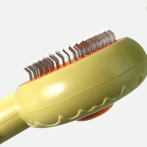 Close-up of the stainless steel pins on the Design Pet Grooming Comb Brush, designed for gentle grooming.