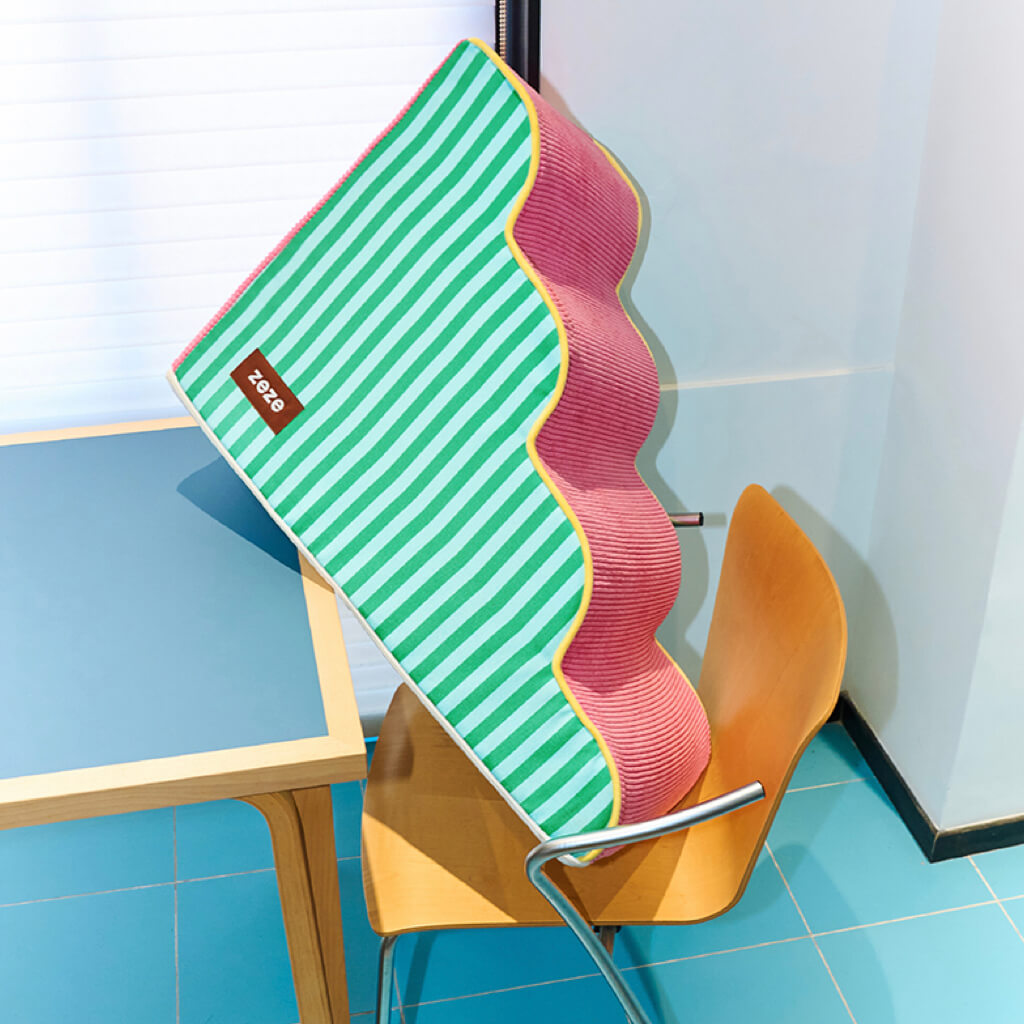 Portable ZEZE foam pet stairs shown lifted on a chair—lightweight design for easy moving between rooms.