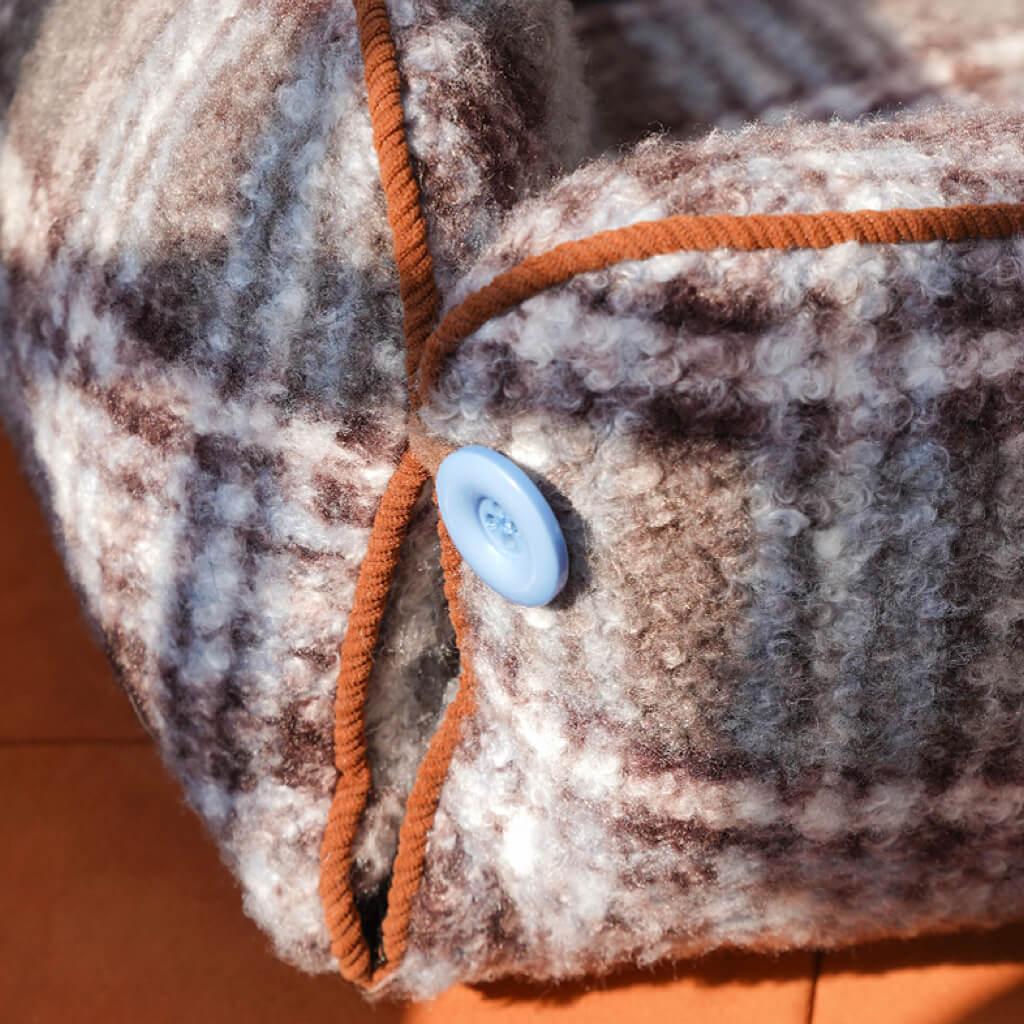 Detail: ZEZE plaid pet sofa bed with blue button and brown piping—durable seams, structured bolsters.