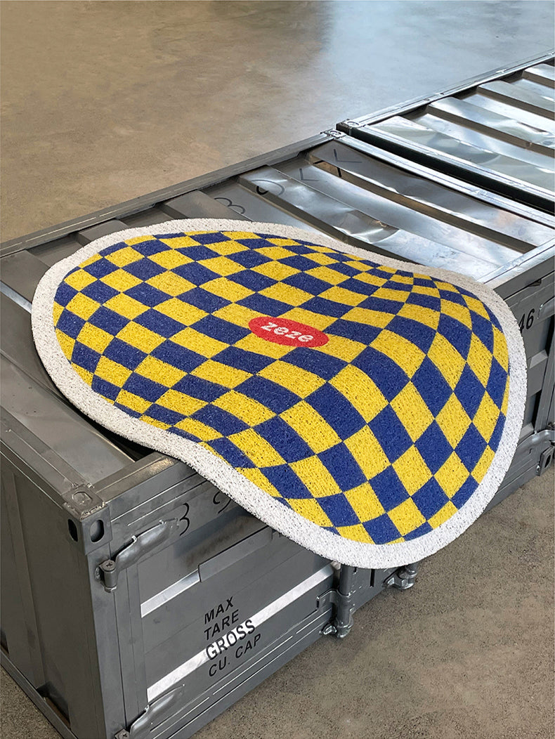 Plaid Design Litter Mat Laid Flat on Industrial Surface.