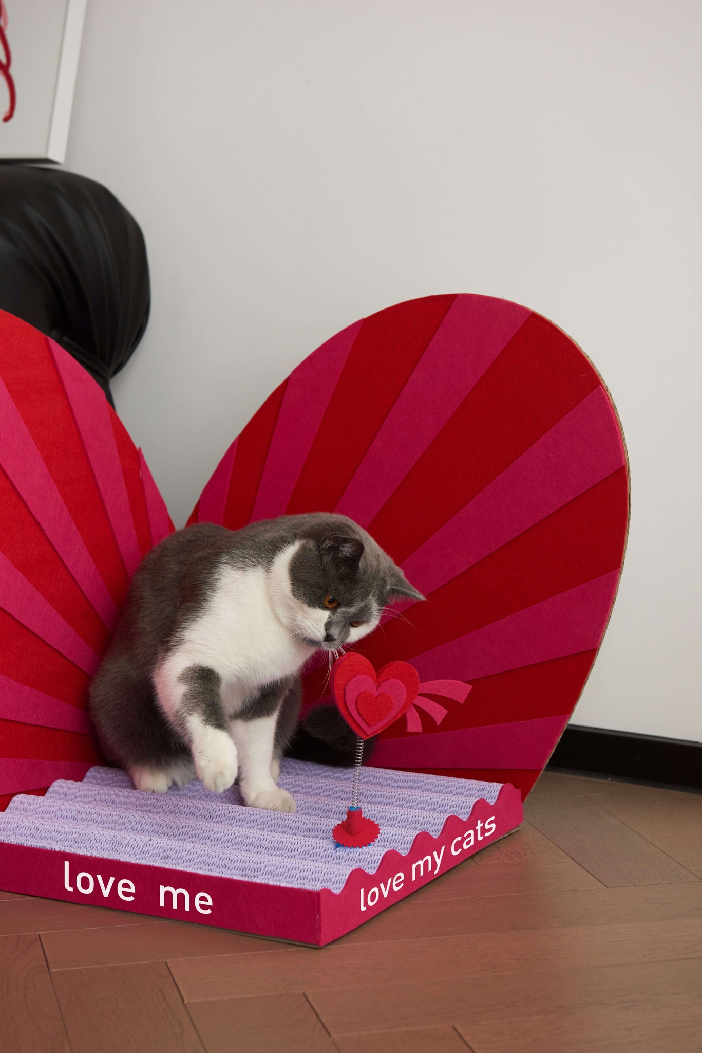 Stylish heart-shaped cat scratcher designed to blend with modern interiors.