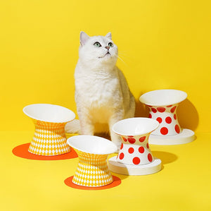 ZEZE Elevated Ceramic Bowls - Red Polka Dots and Yellow Rhombus, with a cat sitting beside them for size comparison.